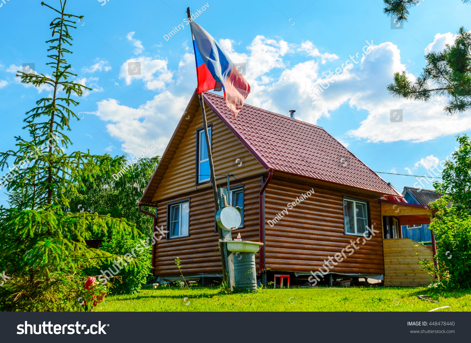 stock-photo-russian-flag-with-a-summer-house-on-the-sky-background-448478440.jpg